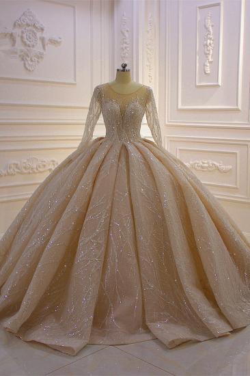 Glänzendes Duchesse-Tüll-Juwelen-Hochzeitskleid mit langen Ärmeln und Rüschen